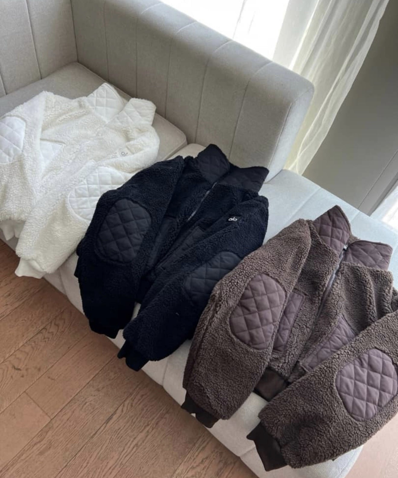 Black, brown, cream fleece in stock